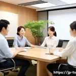 내면의 지혜를 활용한 팀워크 개선 전략 - A modern Japanese office meeting room scene during a weekly team meeting where diverse team members,...